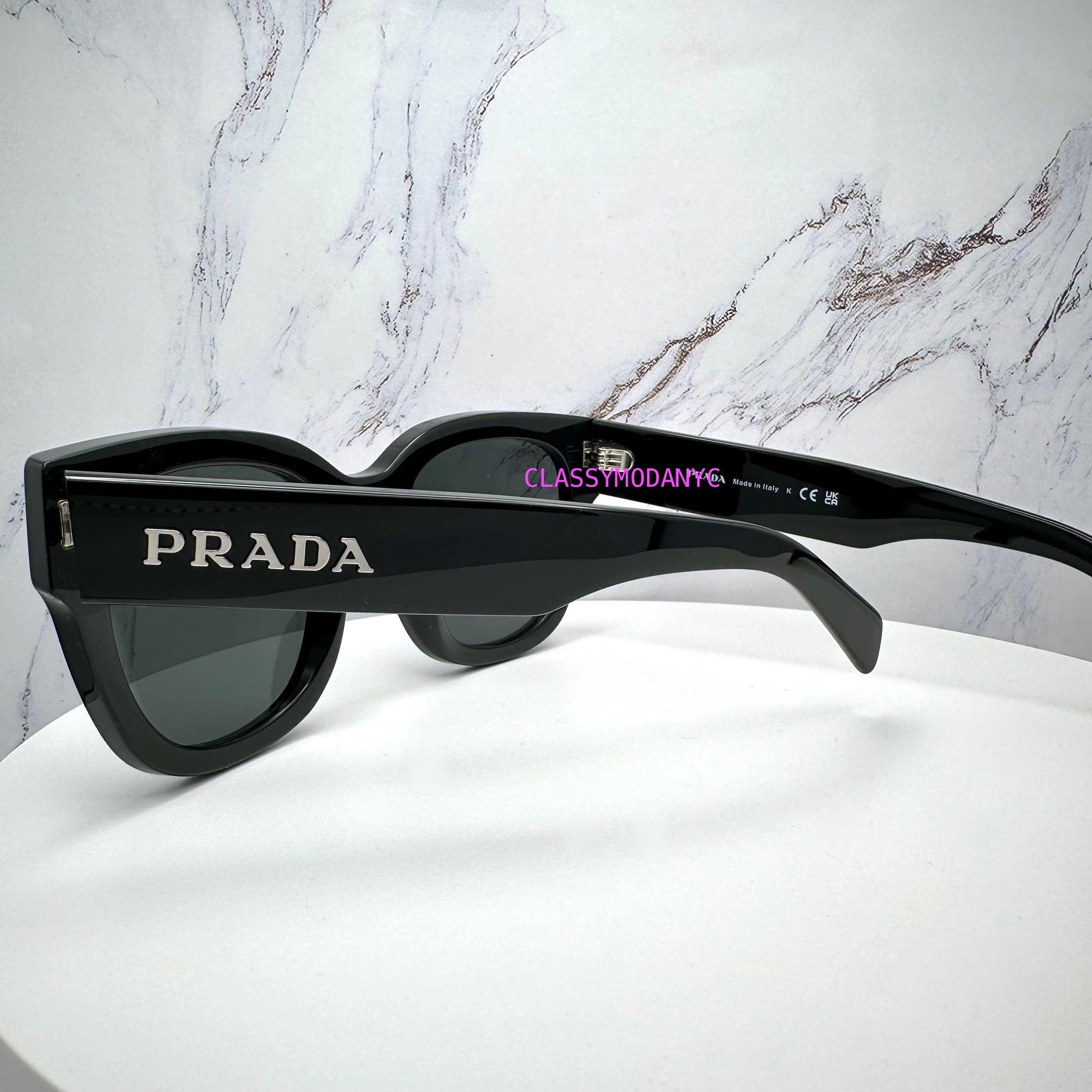Prada PRC04S 16K08Z black sunglasses with silver logo