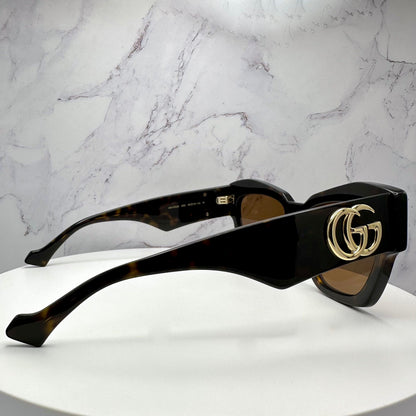 Gucci GG1422S 003 brown tortoise gold metal cat eye sunglasses side view with GG logo
