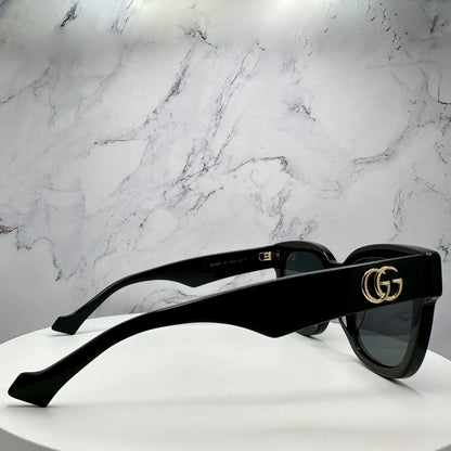Gucci GG0998S 001 black temple arm sunglasses with gold metal side logo