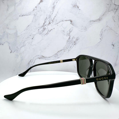 Gucci GG1494S 001 black aviator mens sunglasses with gold letter logo red green enamel lined hardware side view