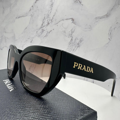 PRADA PR A09S 1AB0A6 black cat eye sunglasses with brown gradient lens for women side view.