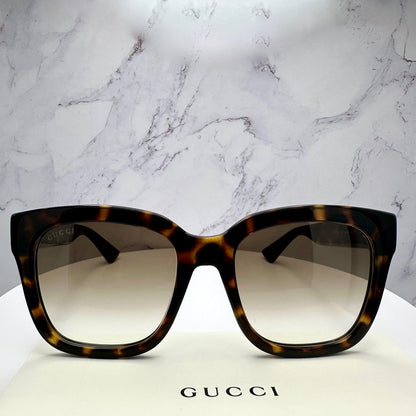 Gucci GG1338S 003 brown tortoise oversized square sunglasses with gold lens.