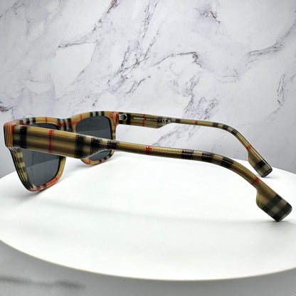 Burberry 0BE4293 3806/87 unisex black sunglasses with checkered logo arms.