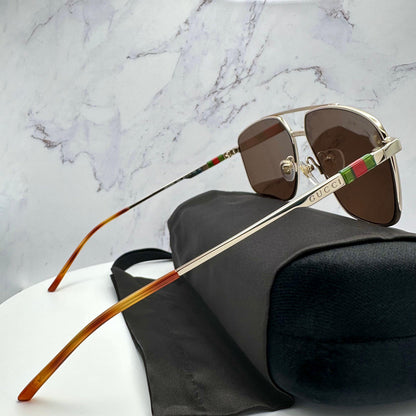 Gucci GG1676S 002 gold metal aviator sunglasses side view with red green web temples