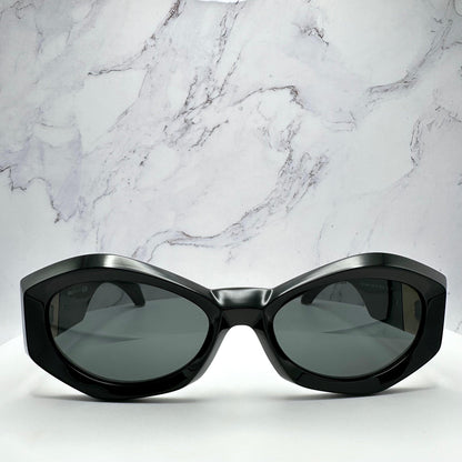 VERSACE VE4466U GB1/87 black oval women's sunglasses with medusa logo.