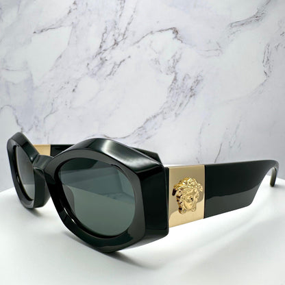 VERSACE VE4466U GB1/87 black oval women's sunglasses with medusa logo.