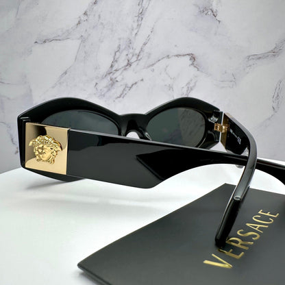 VERSACE VE4466U GB1/87 black oval women's sunglasses with medusa logo.