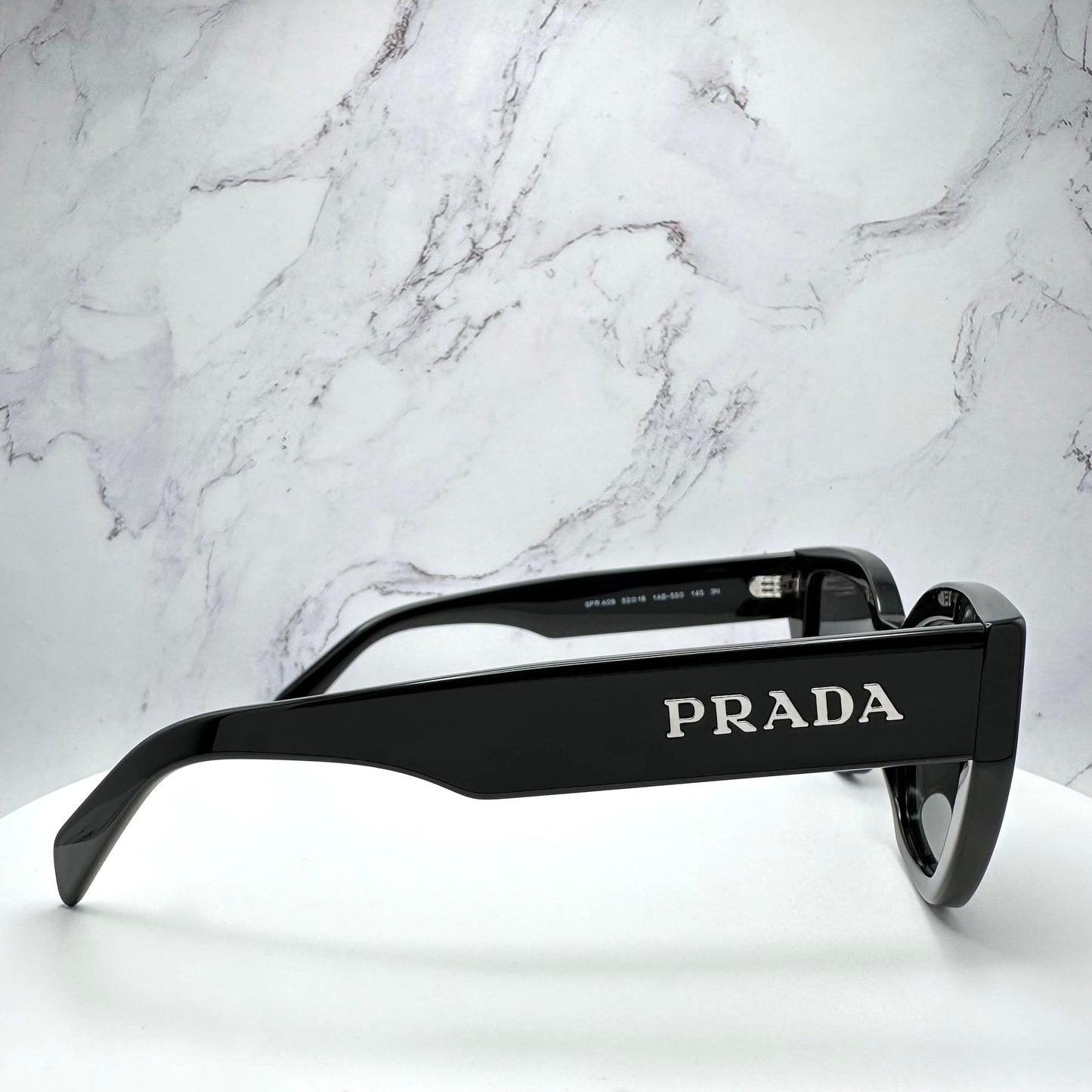 PRADA Sunglasses Black Cat Eye PRA09S Silver Logo 53mm