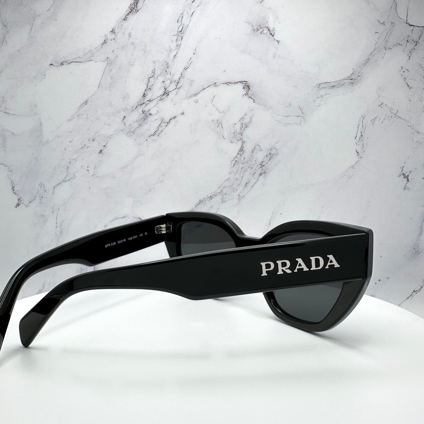 PRADA Sunglasses Black Cat Eye PRA09S Silver Logo 53mm