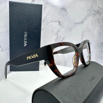 Prada PRA16V 17N1O1 brown tortoise cat eye gold metal logo women's eyeglasses side view with case and box.