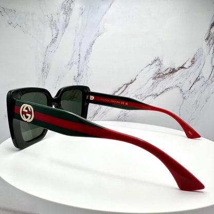 GUCCI GG1861S 005 black sunglasses for women with striped arms gold metal GG logo