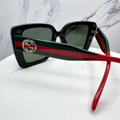 GUCCI GG1861S 005 black square sunglasses with red and green striped arms back view for women
