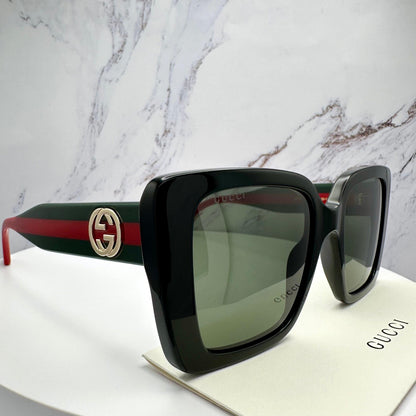 GUCCI GG1861S 005 black square oversized sunglasses with red and green striped arms side view for women