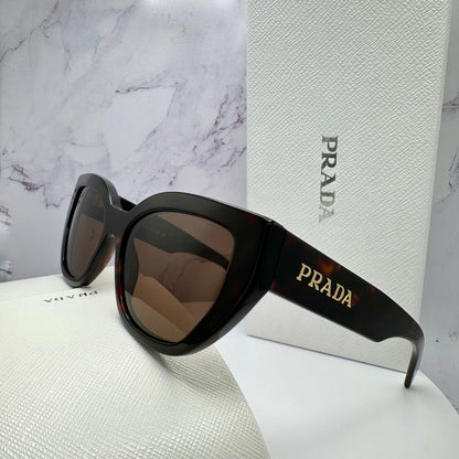 PRADA PRA09S 16N5Y1 tortoise shell sunglasses with brown lens gold logo.