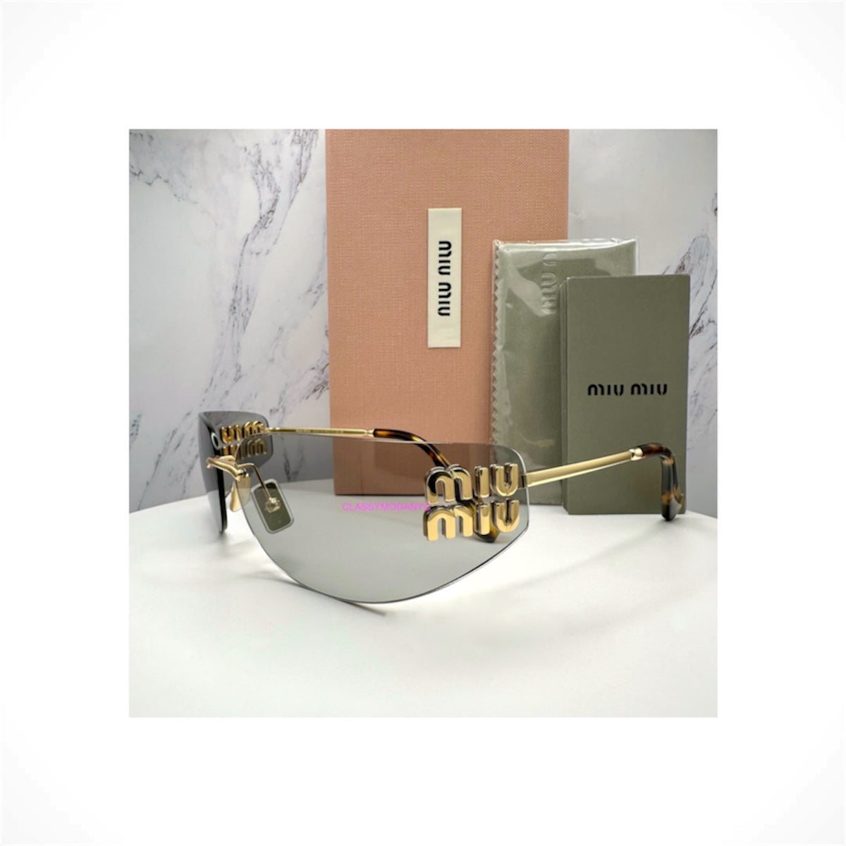 MIU MIU MU A51S 5AK50K women's pale gold rimless wrap shield sunglasses with light gray lenses and gold logo