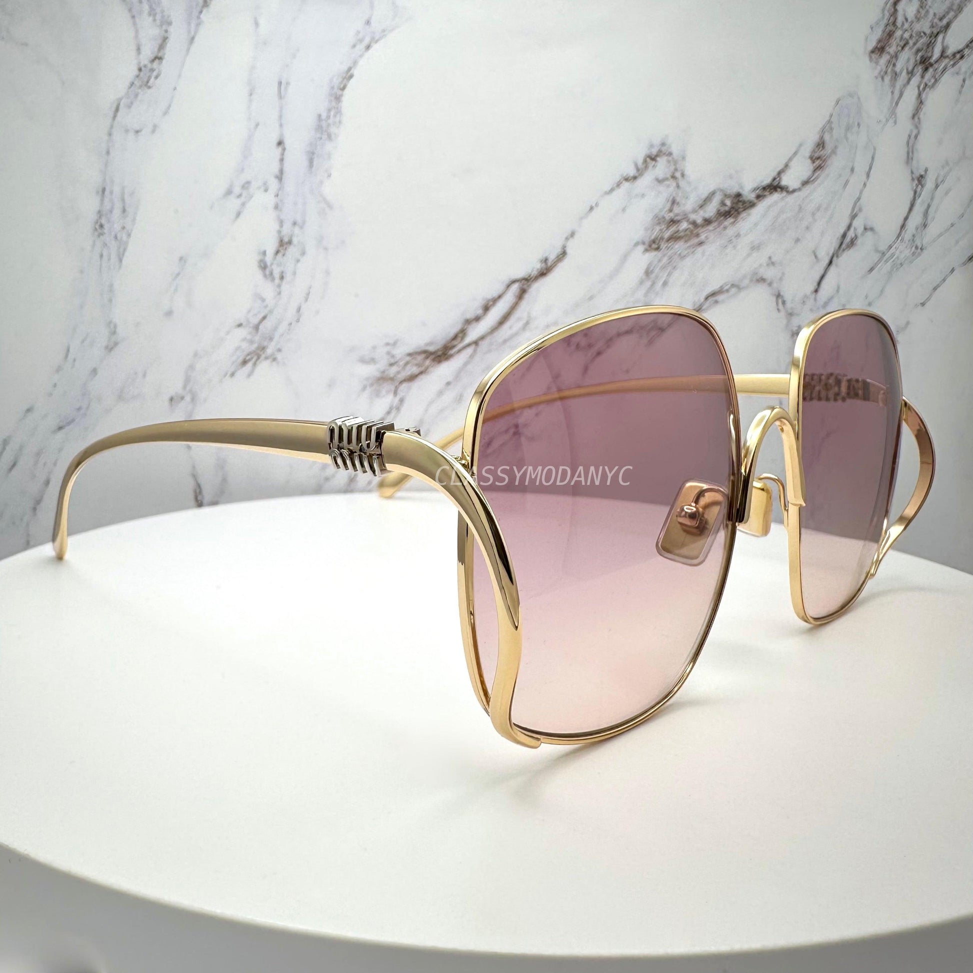 MIU MIU MUA57S 5AK40S gold oversized sunglasses with gradient lens for women side view