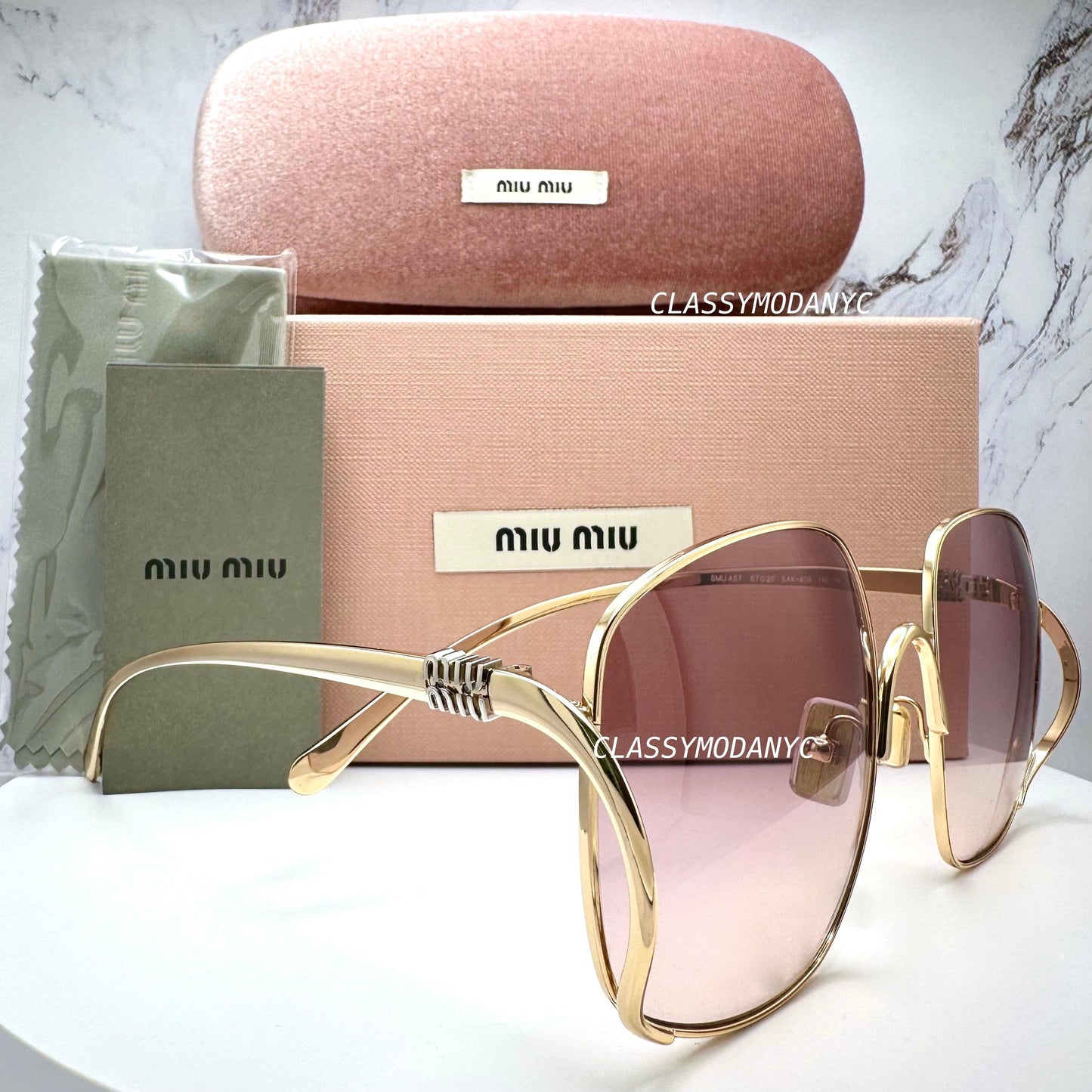 MIU MIU MU A57S 5AK40S gold oversized sunglasses with gradient pink brown lens side view with box and case