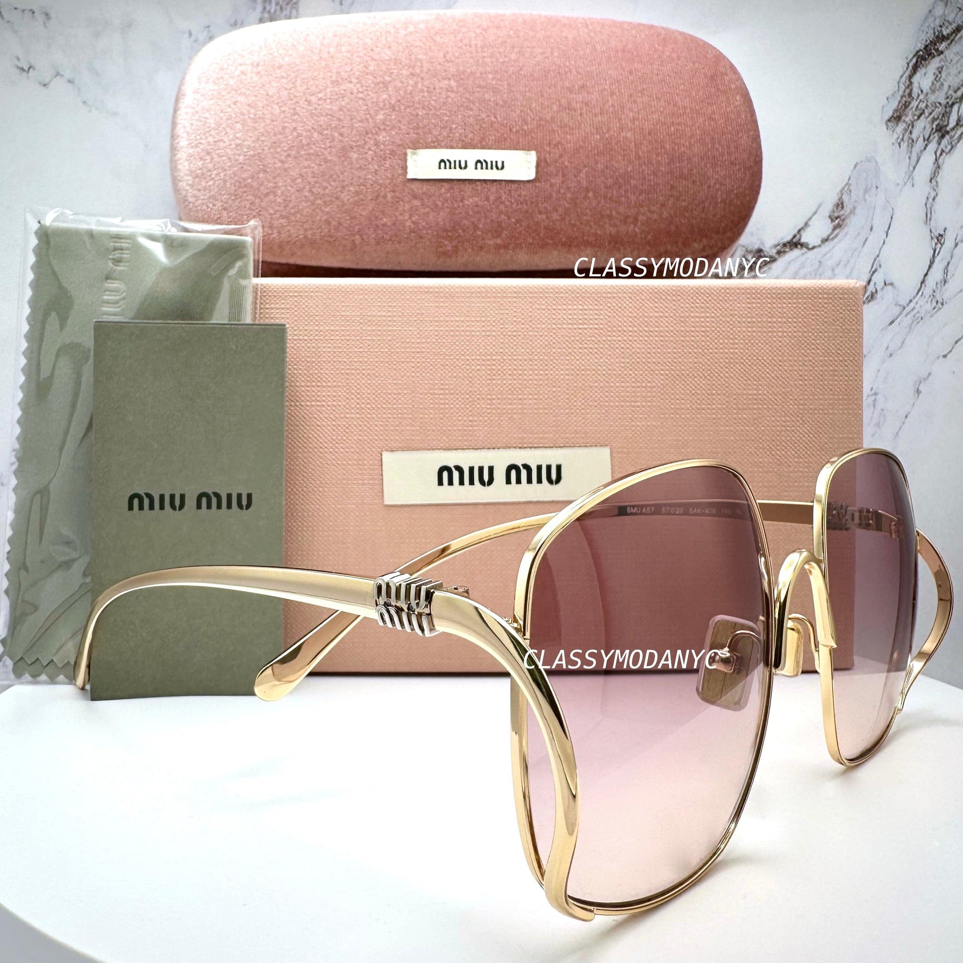 MIU MIU MU A57S 5AK40S gold oversized sunglasses with gradient pink brown lens side view with box and case