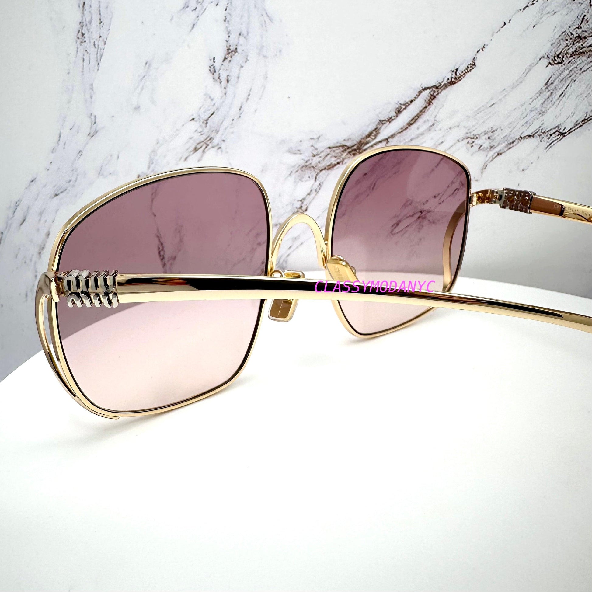 MIU MIU MUA57S 5AK40S gold frame with silver MIU MIU logo