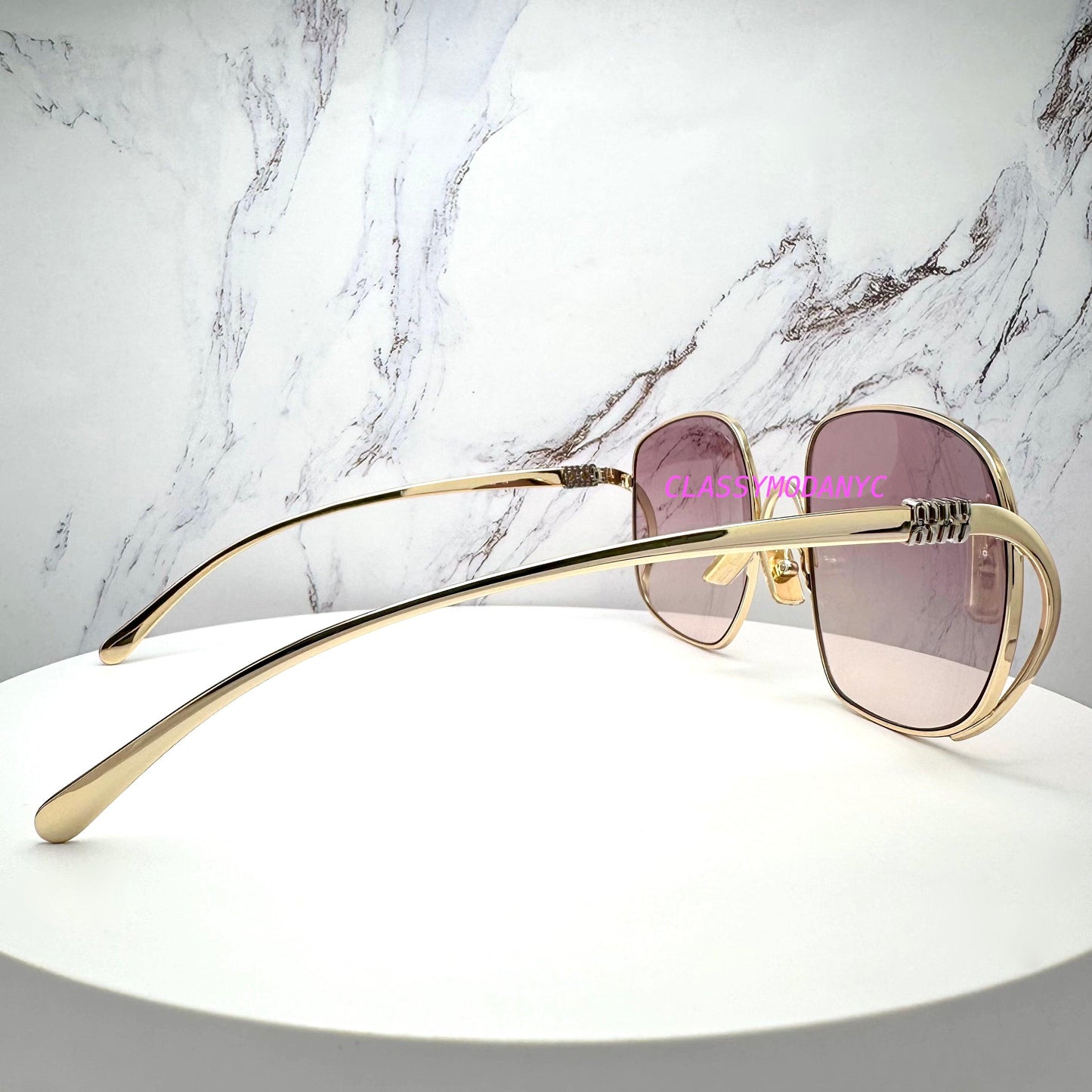 MIU MIU MUA57S 5AK40S gold metal frame with silver contrasting logo sunglasses