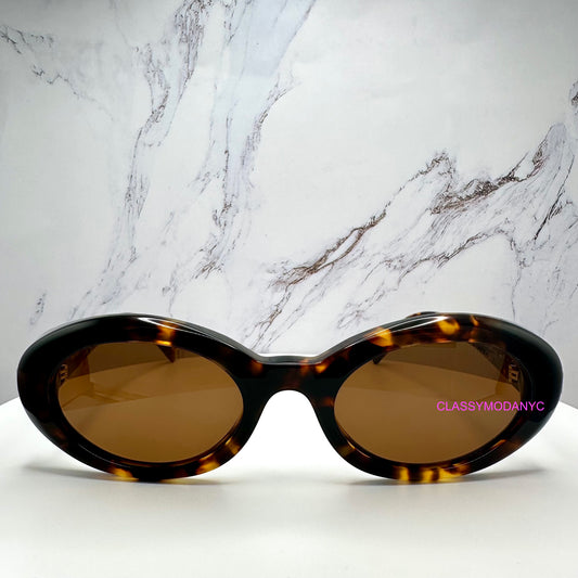 MUB09S 14L20V MIU MIU brown tortoise sunglasses front view 