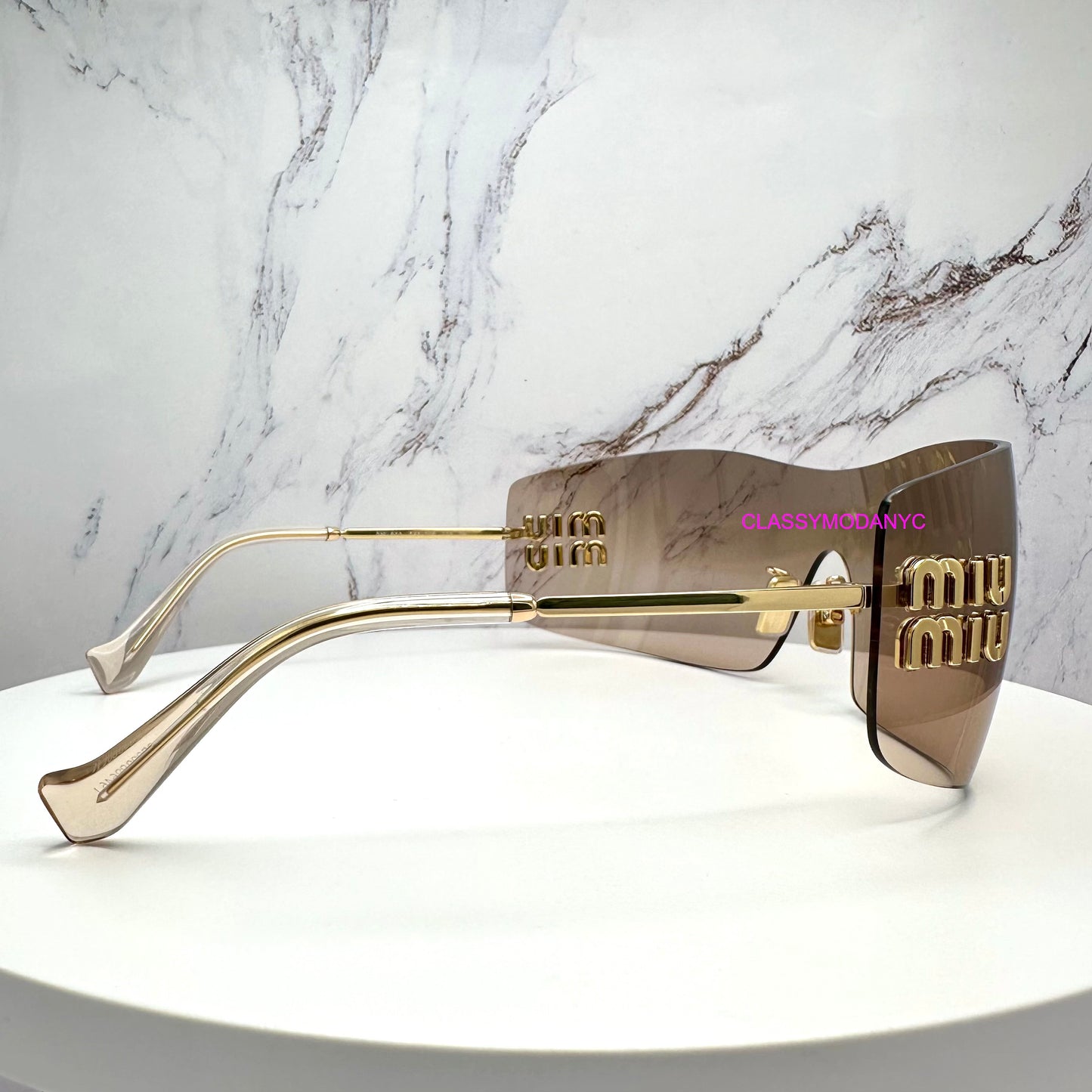 MUB53S 5AK20P MIU MIU sunglasses side view with case