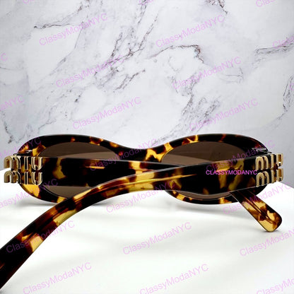 MU 06ZS VAU06B MIU MIU Sunglasses brown oval 