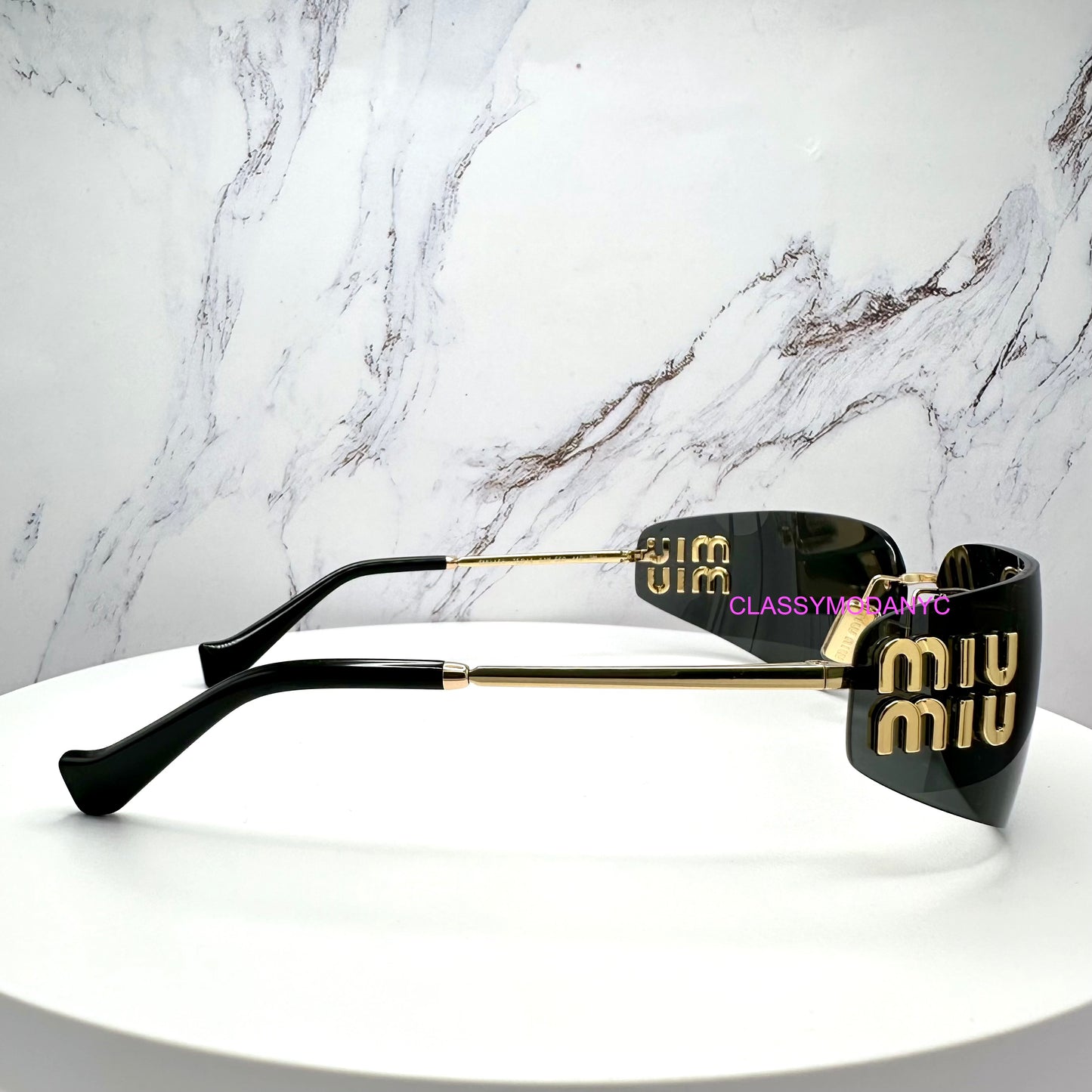 MU A51S 5AK5S0 miu miu sunglasses side view with gold arms and 3D metal miu miu logo 
