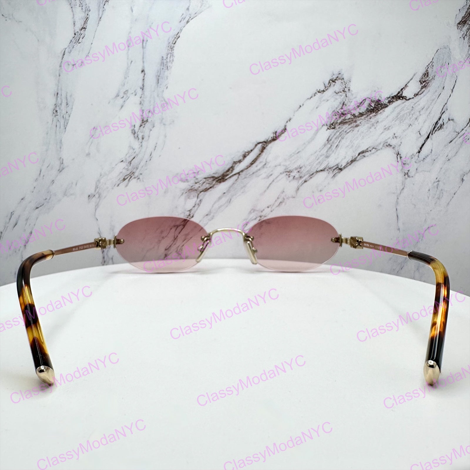 MU A54S ZVN70O MIU MIU gold pink sunglasses 