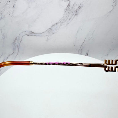 MIU MIU MU52YS 70E1T gold metal sunglasses