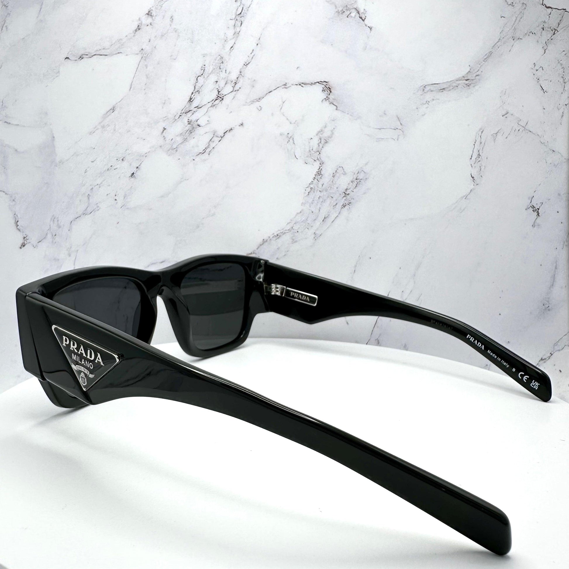 Prada PR10ZS 1AB5S0 black square sunglasses side view.