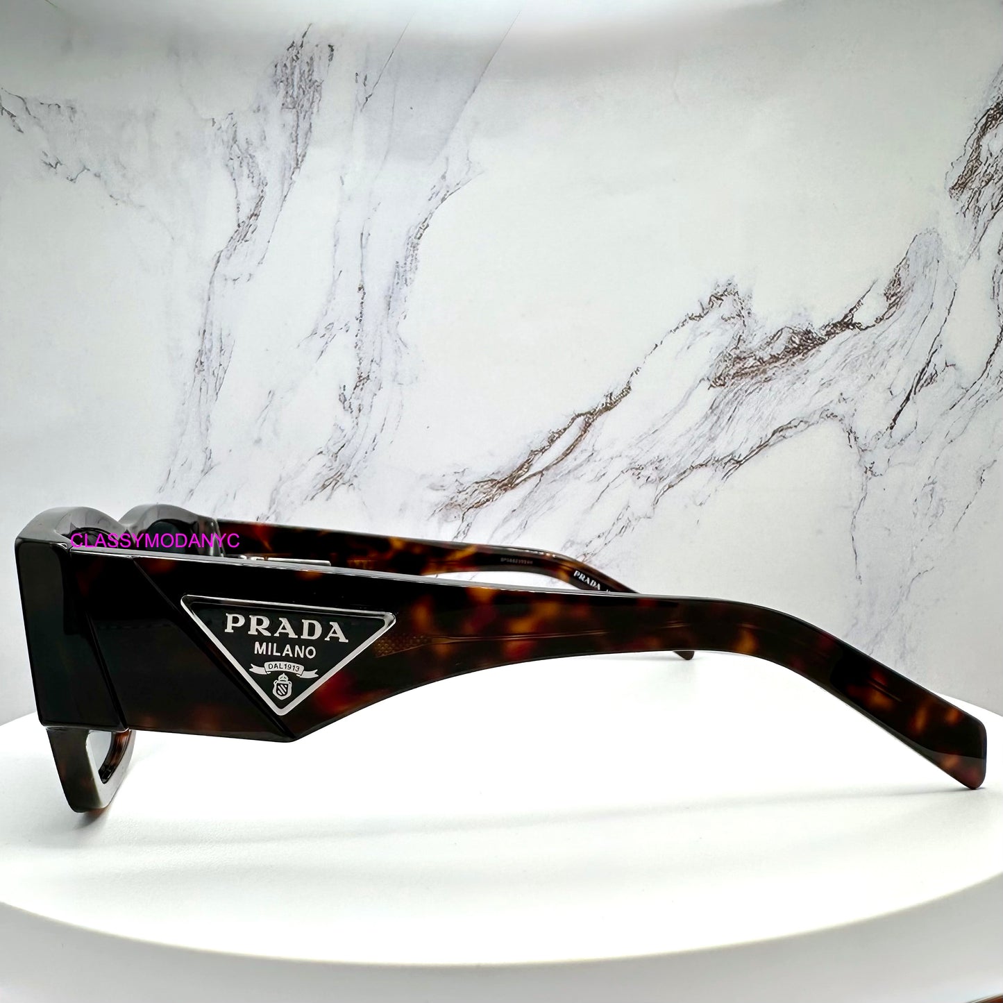 PR 10ZS 17N70B Prada Sunglasses brown side view with triangle plaque logo 