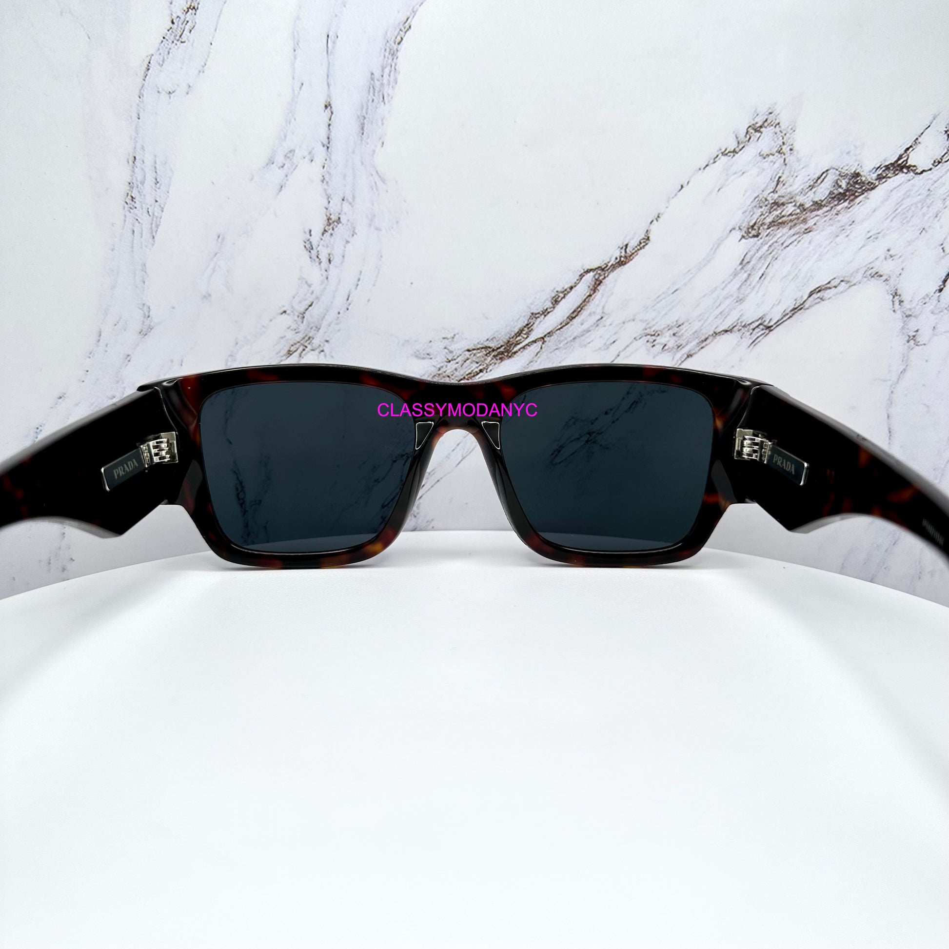 PR 10ZS 17N70B Prada Sunglasses brown tortoise with triangle plaque logo 