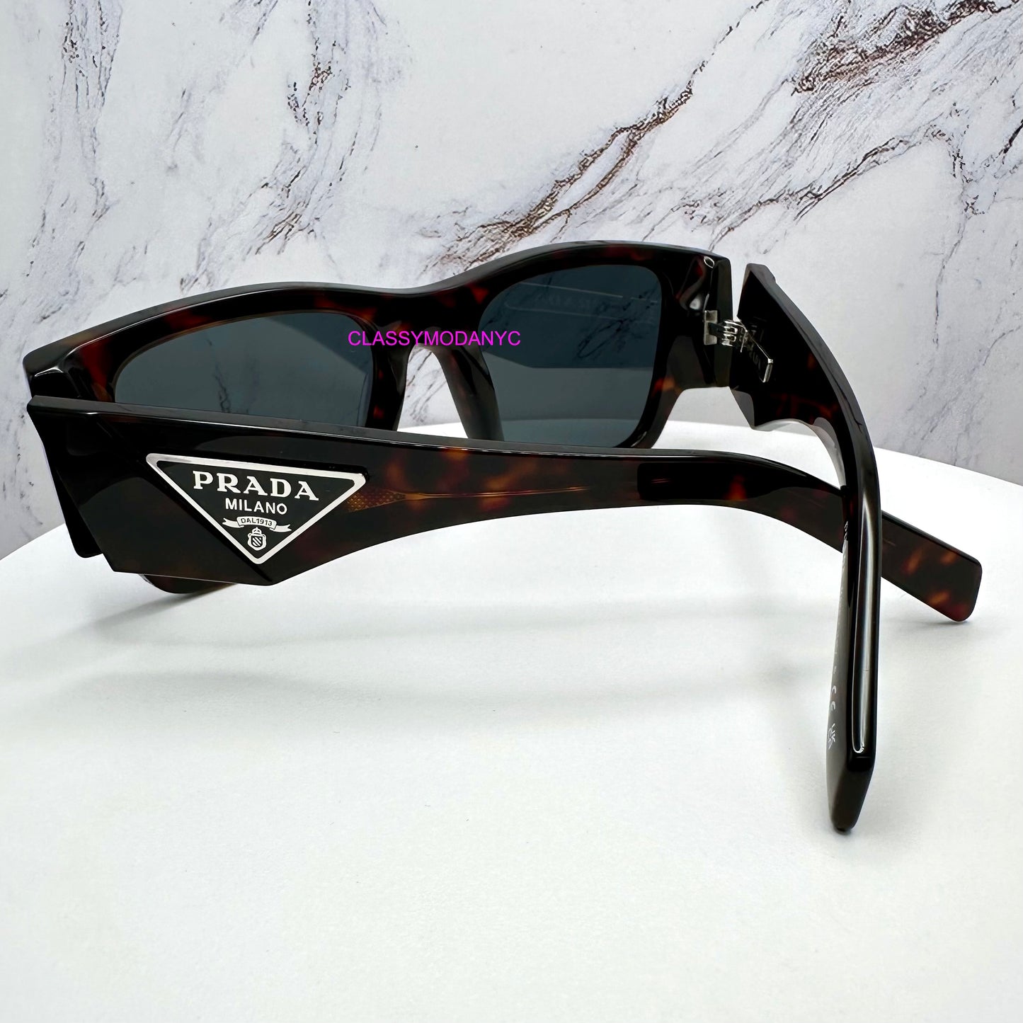 PR 10ZS 17N70B Prada Sunglasses brown with triangle plaque logo back view for men 