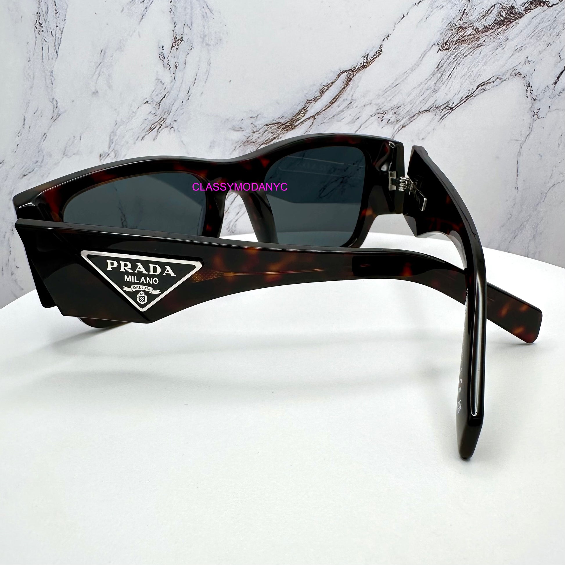 PR 10ZS 17N70B Prada Sunglasses brown with triangle plaque logo back view for men 