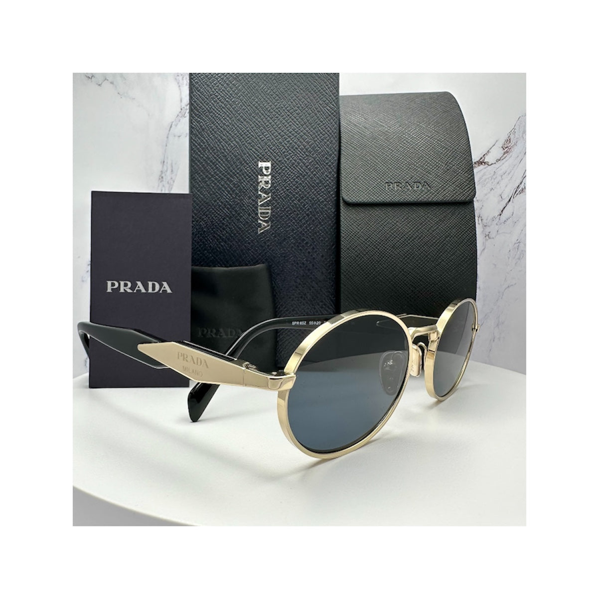 PR 65ZS ZVN09T Prada gold metal sunglasses with grey lens side view 