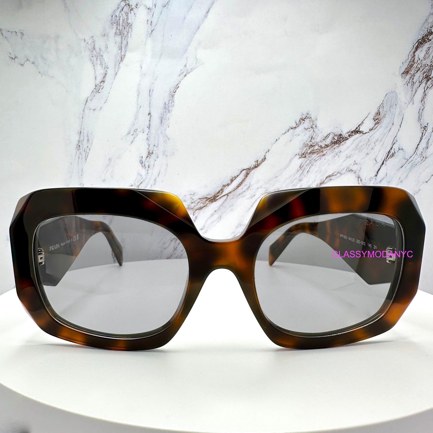Prada PRB23S 20D50Q brown juniper tortoise grey lens symbole oversized sunglasses front view.