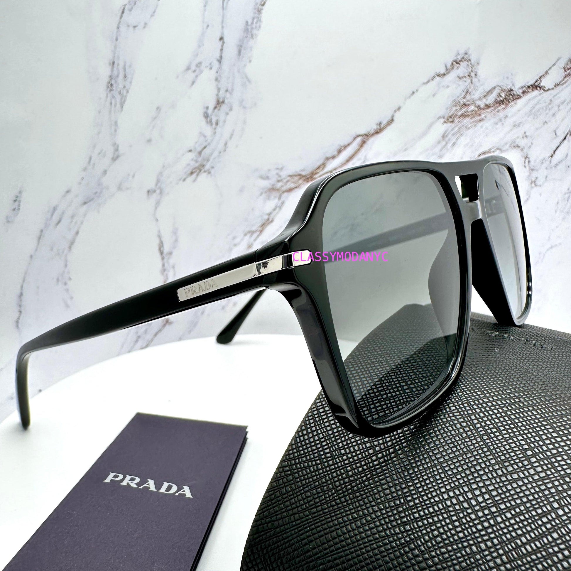 Prada 0PR20YS 1AB06T black aviator sunglasses with grey lens silver logo side view