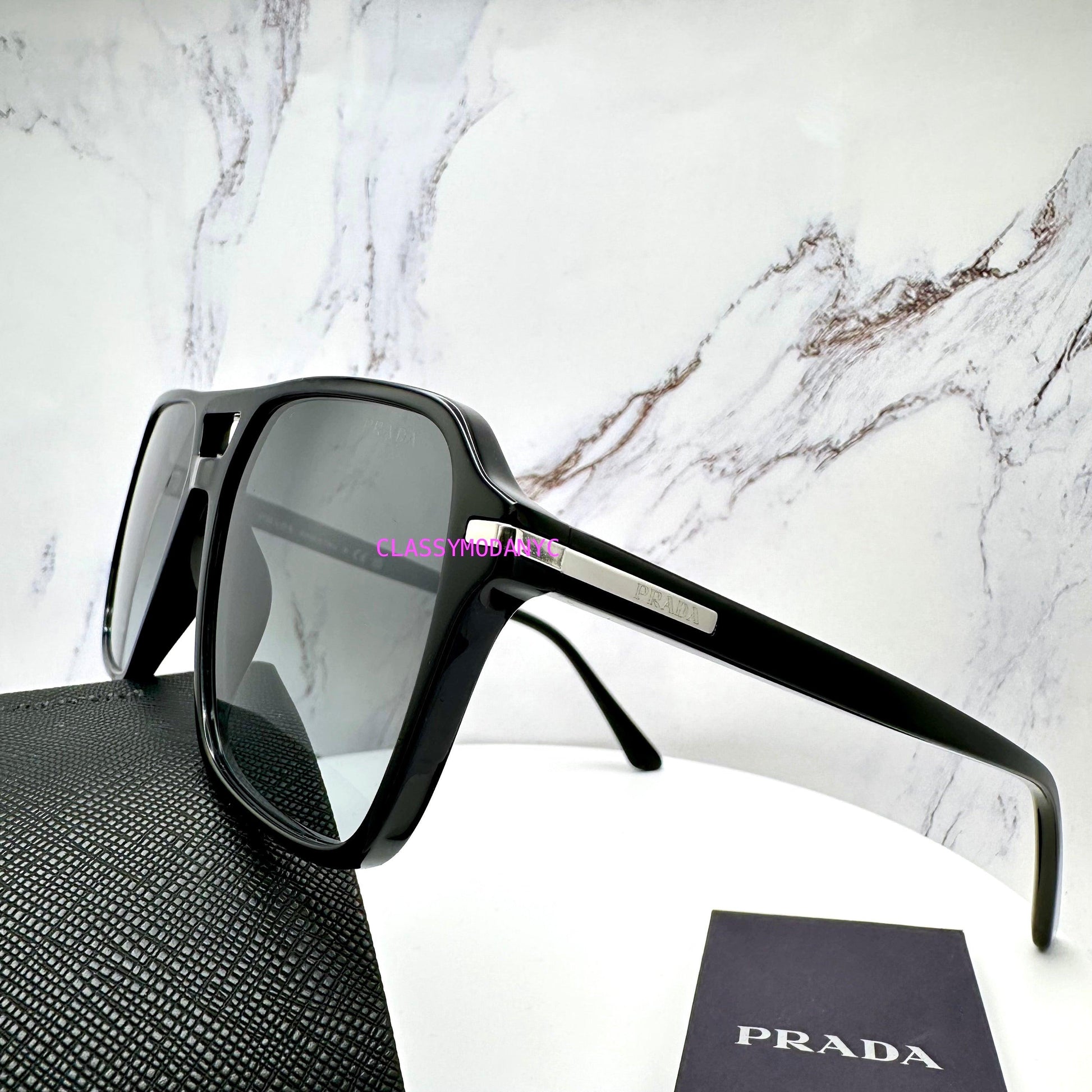 Prada PR20YS 1AB06T black aviator sunglasses with grey lens silver logo side view on Prada case