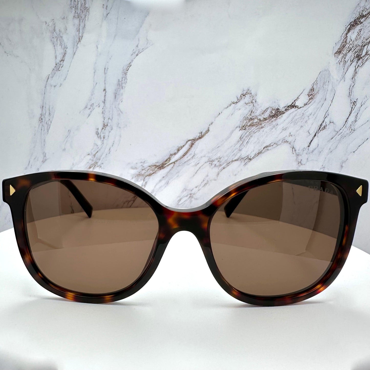 Prada PR22ZS 17N06B brown tortoise round sunglasses front view.