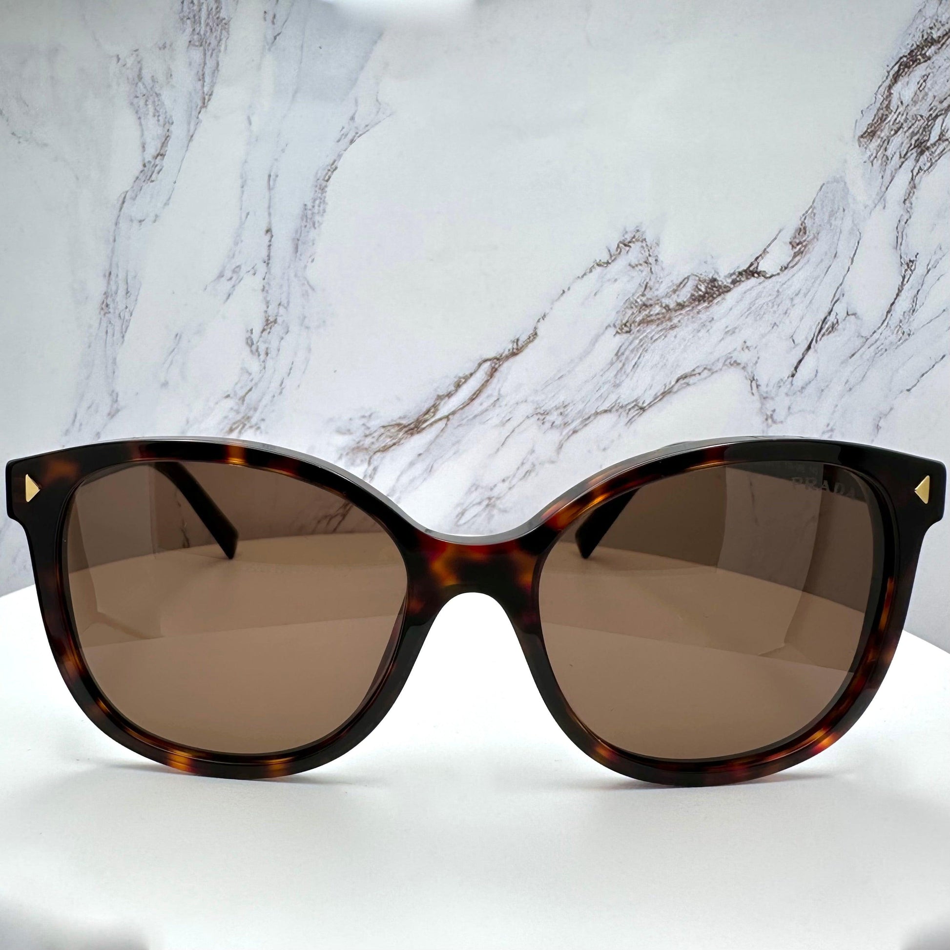 Prada PR22ZS 17N06B brown tortoise round sunglasses front view.
