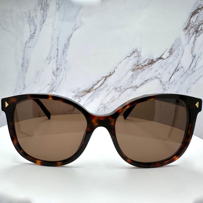 Prada PR22ZS 17N06B brown tortoise round sunglasses front view.