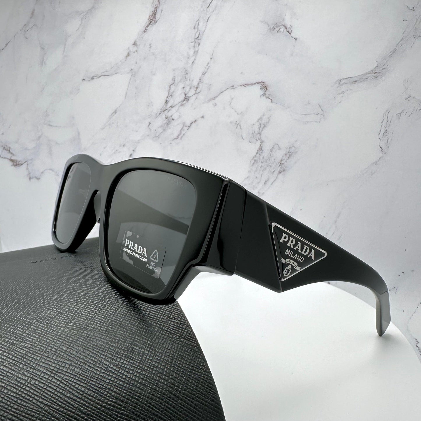 Prada PR10ZS 1AB5S0 black square sunglasses side view.