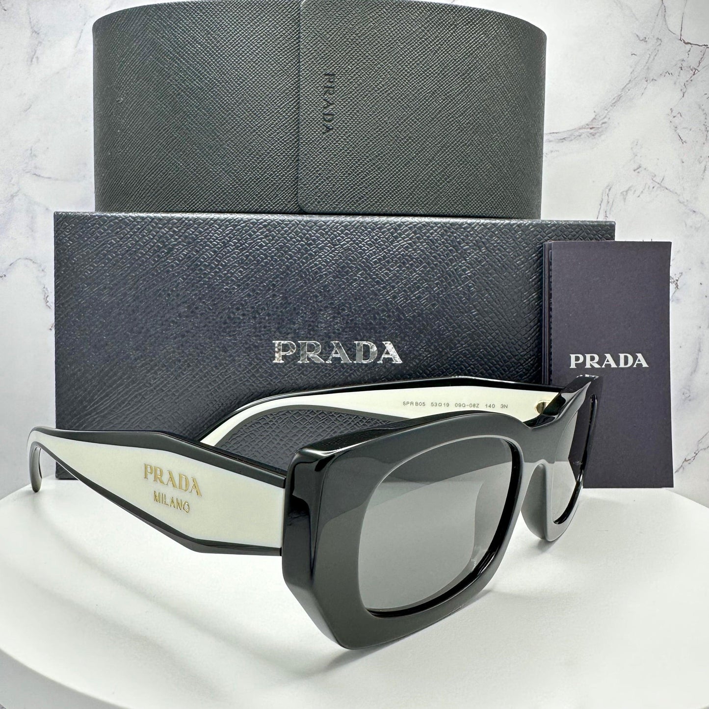 Prada 0PRB05S 09Q08Z black white rectangle symbole sunglasses side view