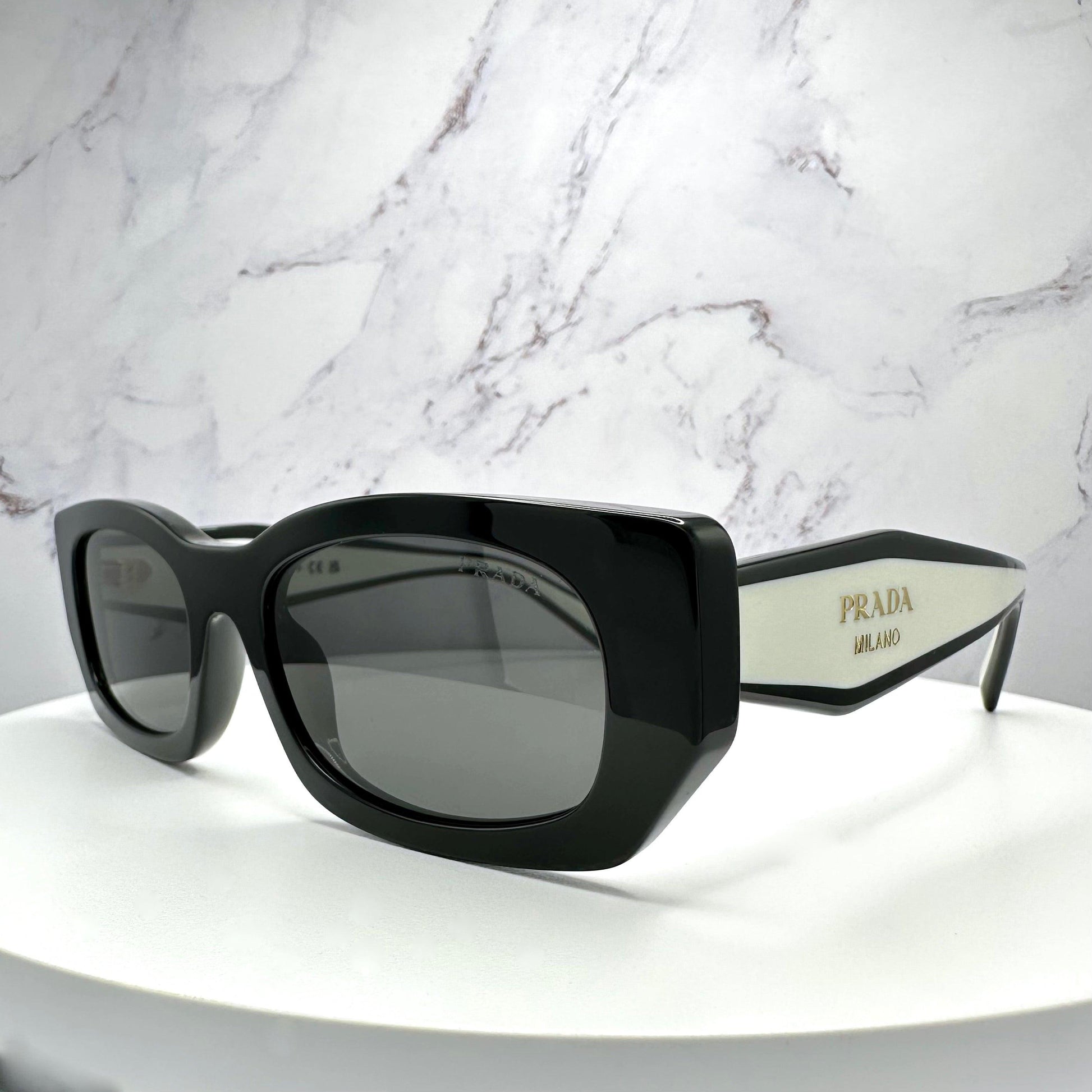 Prada PR B05S 09Q08Z black white sunglasses side view with grey lens