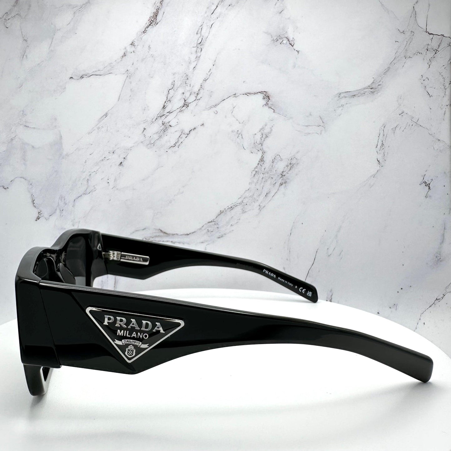 Prada 0PR10ZS 1AB5S0 black sunglasses triangle logo.
