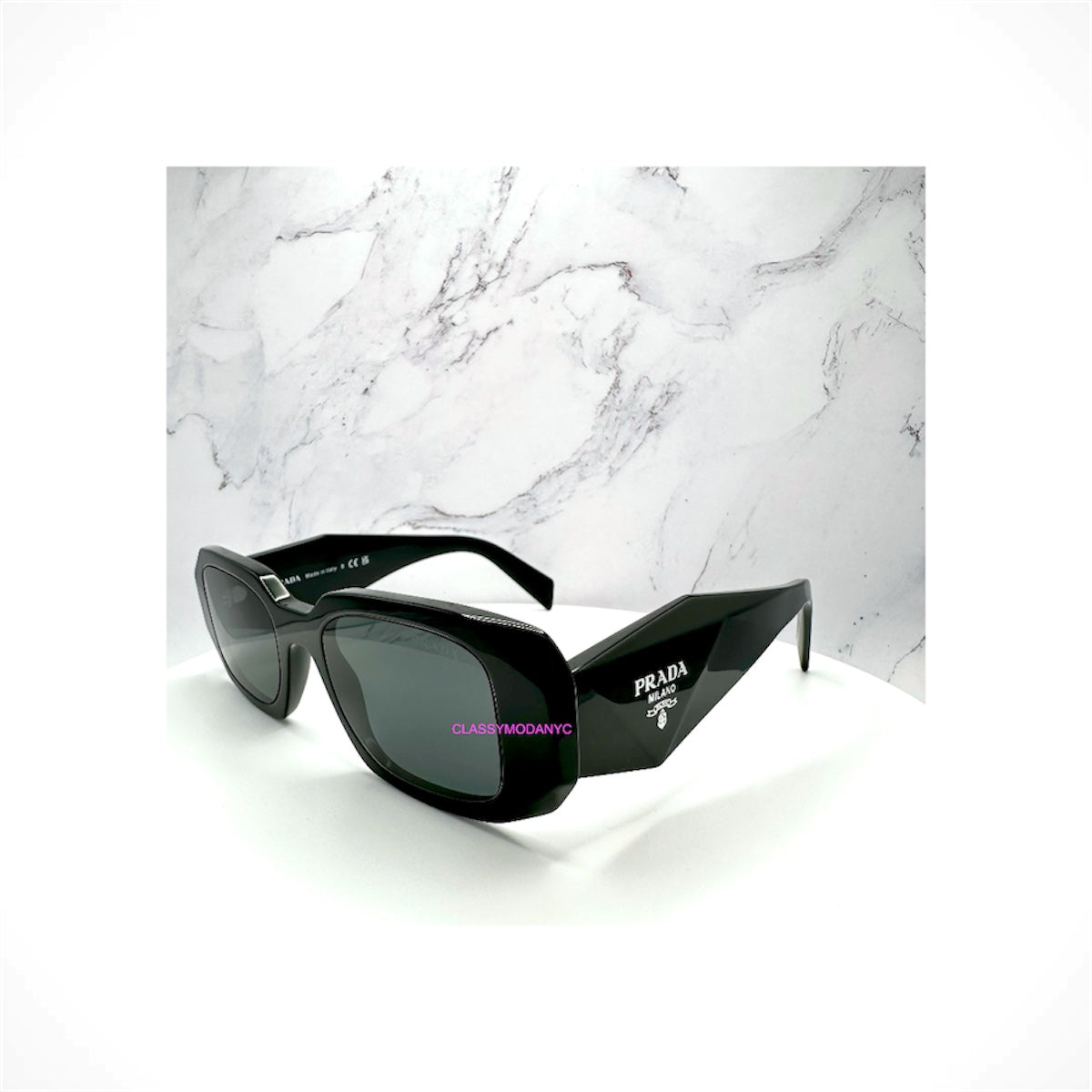 Shop PRADA PR 17WS 1AB5S0 black rectangle sunglasses with gray lenses and silver Symbole logo. Acetate frame, UVA/UVB protection. 100% Authentic. Ships Free.
