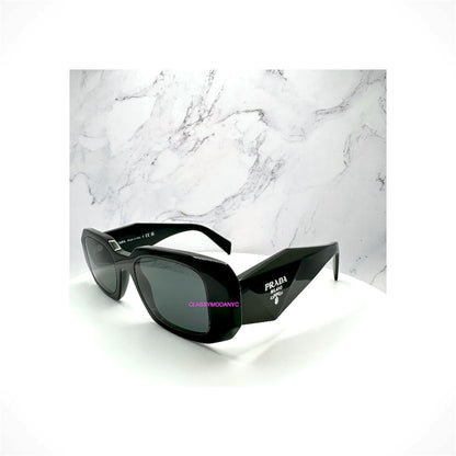 Shop PRADA PR 17WS 1AB5S0 black rectangle sunglasses with gray lenses and silver Symbole logo. Acetate frame, UVA/UVB protection. 100% Authentic. Ships Free.
